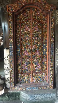 an ornate wooden door with intricate carvings on it