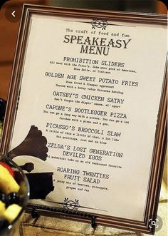 a menu is displayed on a table with fruit