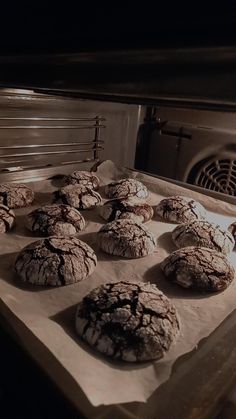 cookies are cooling in the oven on parchment paper lined baking trays, ready to go into the oven