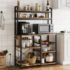 a microwave oven sitting on top of a wooden shelf