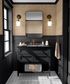 a black and white bathroom with two sinks