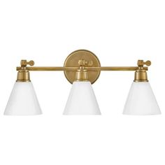 three light bathroom fixture in an antique brass finish with frosted glass shades on the sides