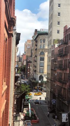 a city street filled with lots of tall buildings