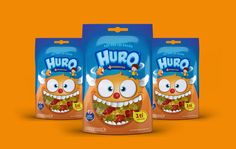 three bags of hug cereal on an orange background