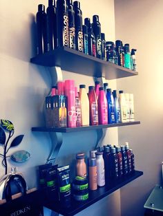 the shelves are filled with different types of hair products