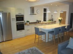 the kitchen is clean and ready to be used as a dining room or living room