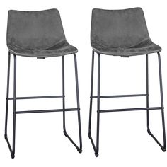 pair of grey velvet bar stools with metal frame legs and foot rests on white background