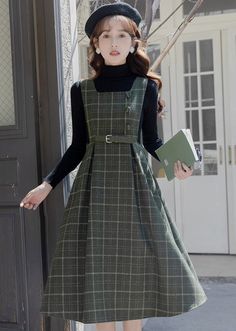 Our signature tweed plaid fabric in a classic pinafore silhouette. Features a square neckline, open sides, buttons, belted waist and midi length skirt. Lined. Concealed side zipper. S: 24.5" waist, 42" lengthM: 26" waist, 42" lengthL: 27.5" waist, 42.5" lengthXL: 29" waist, 42.5" length Fall Plaid Dress With Square Neck, Winter Plaid Tweed Dress, Fall Workwear Midi Dress With Square Neck, Square Neck Winter Workwear Dress, Winter Workwear Dress With Square Neck, Square Neck Midi Dress For Fall Workwear, Square Neck Midi Dress For Work In Fall, Wool Pinafore, Academic Chic