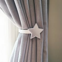 a curtain with a white star attached to it