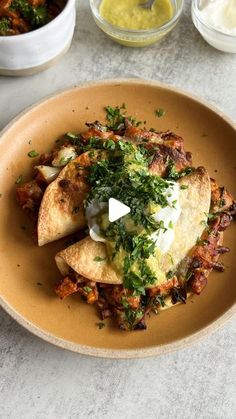 an omelet is served on a plate with other dishes