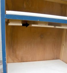 an empty shelf is shown with blue trim