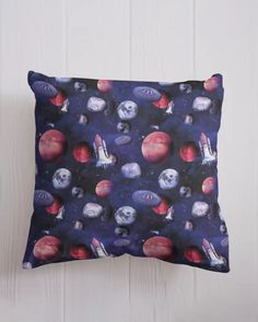 a pillow with an image of planets on it