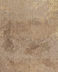 an area rug with gold and brown designs on it, including circles and lines in the middle