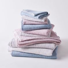 a stack of folded towels sitting on top of each other