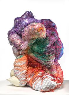 multicolored yarn piled on top of each other