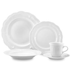 a white dinner set with two cups and saucers