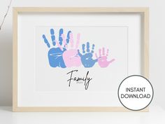 a family handprint is displayed in a wooden frame