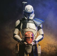 a star wars character standing in front of a dark background wearing a helmet and armor