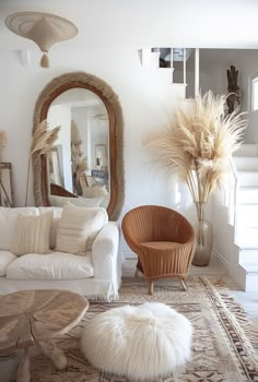 a living room filled with furniture and a large mirror