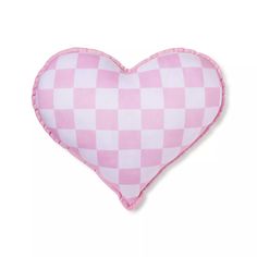 a pink heart shaped pillow on a white background