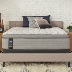 an image of a mattress in the middle of a bed frame with pillows on it