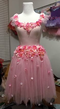 a dress made out of tulle and flowers