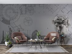 a living room with two chairs and a table in front of a wall mural that has architectural drawings on it