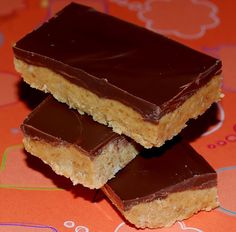 two pieces of peanut butter bars stacked on top of each other