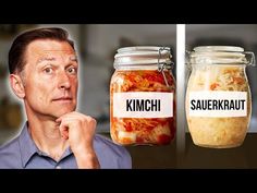 a man standing in front of two jars filled with food and the words kimchi, sauerkraut