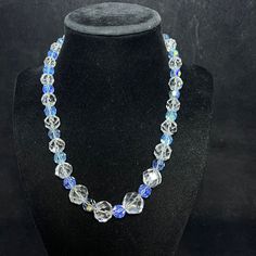 "Vintage Silver Tone Faceted Clear And Blue Beaded Necklace. There are no hallmarks on the necklace. I tested the beads with my Presidium Gem Tester II. The blue beads tested glass and the clear beads tested between Quartz and Spinel. It has a barrel clasp. The necklace measures: 18\" The blue beads are all the same size :8.5mm The clear beads start small and get bigger starting at: 9.5 mm to the largest one : 13.9 mm. They weigh 2.35 oz It comes with a gift box. (Jewelry #3141) USA Seller!! Est Blue Faceted Round Bead Crystal Necklace, Blue Faceted Crystal Necklace With Round Beads, Blue Faceted Round Bead Necklaces, Blue Faceted Necklaces With Round Beads, Blue Necklaces With Faceted Round Beads, Formal Blue Single Strand Beaded Necklace, Blue Crystal Beaded Necklaces For Jewelry Making, Blue Round Beaded Glass Crystal Necklace, Blue Crystal Necklaces With Round Glass Beads