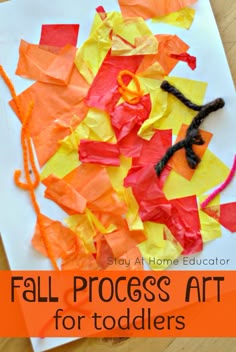 an art project for toddlers with paper and scissors