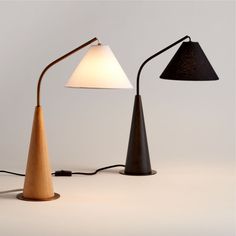 two lamps with one light turned on and the other turned off