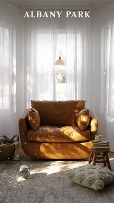 a living room filled with furniture and windows