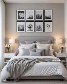 a bedroom with pictures on the wall above the bed