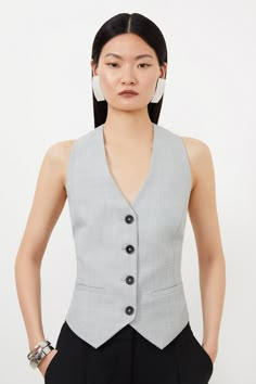 Tailored To An Idyllic Fit, This Chic Vest Is A Staple In Any Closet. Cascading Buttons Create A Flattering Hourglass Silhouette, While A Sleeveless Design And V-Neck Add A Classic Touch. An Ideal Trend-Forward Option From The Office To Dinner For A Sleek Ensemble.Tailoredwaistcoatsleeveless Cheap Classic Single-breasted Vest, Cheap Fitted Spring Vest, Cheap White Vest For Workwear, Trendy Fitted Vest At Affordable Price, Waist Coat For Women, Christmas Dinner Outfit, Grey Waistcoat, Waistcoat Women, Ladies Waistcoat