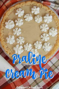 a pie with marshmallows on top and the words prairie cream pie above it