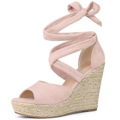 a women's wedged sandal with tied up straps