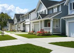 row of houses with landscaping in front of them