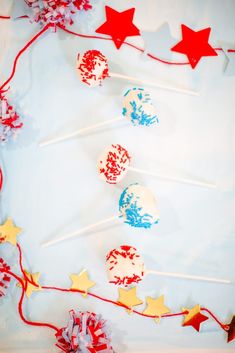 red, white and blue lollipops with stars on them