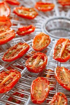 several sliced tomatoes on a wire rack