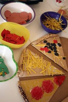 paper plates and bowls filled with different types of food