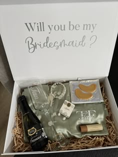 an open box with wine, champagne and other items in it that says will you be my bridesmaid?