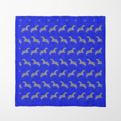 a blue bandana with yellow horses on it