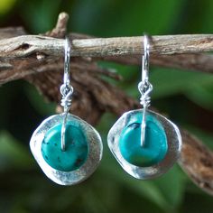 "Silver Cornflake Disc Earrings with Turquoise - Silver and Turquoise Earrings - Turquoise Earrings - Unusual Earrings Wavy \"cornflake\" beads plated in fine silver are topped with genuine turquoise rondelles in these turquoise drop earrings. They dangle from sterling silver French earwires. These silver and turquoise earrings are like a ray of summer sunshine and have proven to be one of the most popular earring styles offered in our Ambrosia Collection. Imported from Greece, the wavy \"cornfl Bead Styles, Western Bracelets, Popular Earrings, Earring Styles, Turquoise Hoop Earrings, Turquoise Drop Earrings, Unusual Earrings, Summer Sunshine, Turquoise Bracelet Cuff