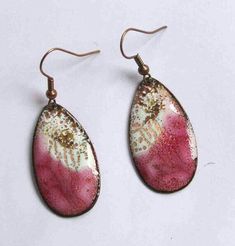 two pairs of pink and white earrings