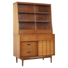 an old fashioned wooden cabinet with drawers