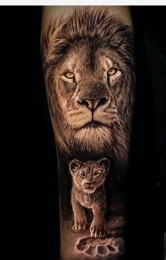 a lion and its cub tattoo on the arm, with an animal's face