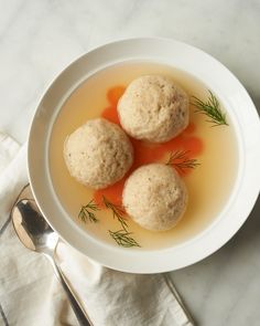 three balls of soup in a white bowl