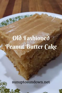 a piece of peanut butter cake on a plate with the words old fashioned peanut butter cake