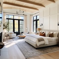 a large bed sitting inside of a bedroom on top of a hard wood floored floor